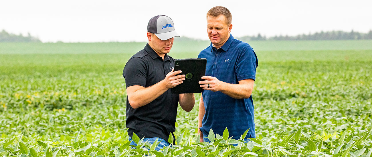 Two men on an ipad